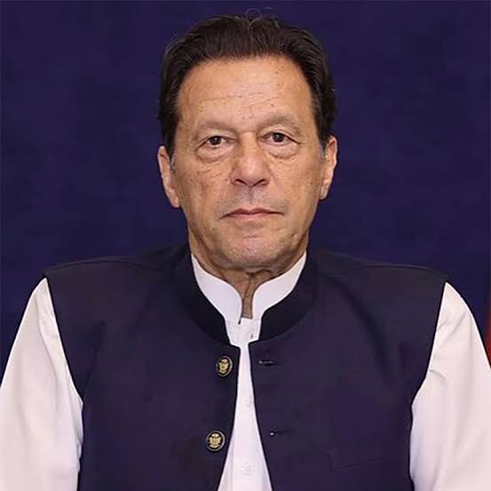Imran Khan in a navy waistcoat and white shalwar kameez